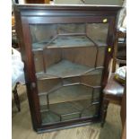 A mahogany corner unit. 20th century. Approx. 108cm x 73cm x 43cm