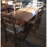 An oak Refectory-style table by Webber of Croydon, including 6 dining ladder-back chairs of which