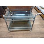 Stainless steel chromium plated hostess trolley. 66cm x 87cm x 47cm