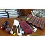 Assortment of clay pipes and pipe stand