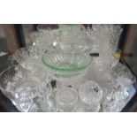 A green glass bowl, clear glass bowls , a salt, a bell, and two glasses. (15)