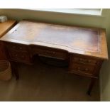 Desk with drawers either side and red leather insert on top. Restoration needed on leather. 78cm x