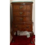 A Bow front chest of drawers. 20th century. 96cm x 40cm x 33cm