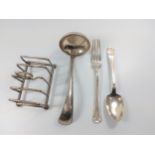 A Dutch ladle, American spoon and fork. London toast rack