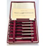 A cased set of six silver-handled possibly Hukin & Heath tea knives in the style of Queen Anne. 1977