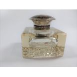 A glass inkwell having a silver and tortoiseshell lid. Birmingham 1922