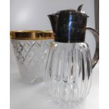 A silver-plated and cut glass lemonade jug and a gold-plated cut glass ice bucket