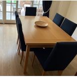 A Mid 20th Century Dining table (77cm x 145cm x 59cm) and 6 chairs.