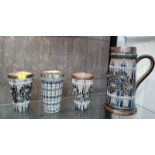 A Doulton Lambeth jug and two beakers with silver trims and a beaker with plated rim (4)