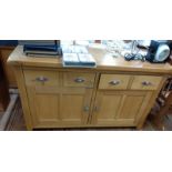 A 20th century sideboard. Blond oak. 80 x 136 x 42cm