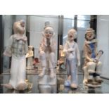 Four Casades porcelain clown figures 24cm to 27cm (4)