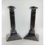 A pair of silver-plate Corinthium column candlesticks 20cm