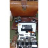 Two leather briefcases with shave certificates, a camera, opera glasses, dents, bell and a shaving