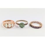 Three dress rings; opal, emerald, and eternity 5.50g size L. Circa 1900/1920.