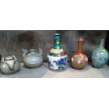 A miscellaneous collection of three bottle vases and two Oriental vases decorated with animals