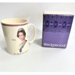 A Queen Elizabeth II Silver Jubilee mug. By Wedgwood. With original box. Circa 1977. (2)