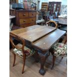 Oak extending dining table and three balloon back chairs. early 20th century.