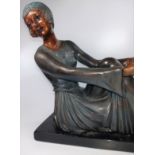 An Art Deco lady 30cm h x 41cm wide