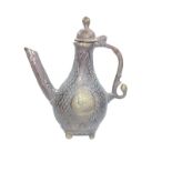 A Moghul Bronze Coffee pot. 19th century. Decorated with diaper work.17cm high.