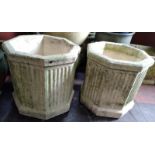 Two octagonal concrete garden pots