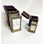 Two Brass carriage Clocks with leather carrying cases. Both circa 1900. No keys.