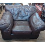 A leather Upholstered Snuggle Chair. 20th century.