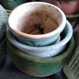 Three concrete garden pots