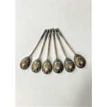 A set of Six Russian Imperial Silver Gilt and Champlevé Enamel Spoons. Possibly by Anton (