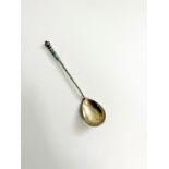 An Imperial Russian Parcel Gilt and champlevé Enamel Spoon. Circa 1900. 14cm long. 18.95 grams.