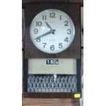 A Seiko Mantel Clock. Mid 20th century. The white enamel dial with Arabic numerals. With a