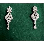 A Pair of Post Drop earrings. Early 20th century. Possibly White Sapphires set in white metal.