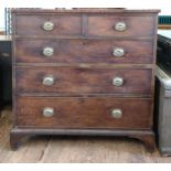 A large George III mahogany chest of drawers on bracket feet: two short over three long drawers with