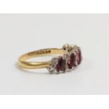 A Ruby and Diamond dress Ring. Set in hallmarked 18carat yellow gold. Size O. 3.69grams.