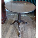 A round top pedestal table