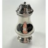 Meshach Godwin. A George I Sterling Silver Caster. London 1726.The plain baluster body applied