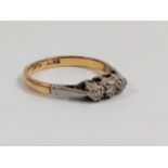 A three stone Diamond ring set in 18c yellow gold. Size H. 2.2 grams.