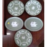Three Wedgwood green jasperware plates and two oval dishes (5)