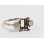 A Diamond set Ring. Central stone missing. Set in high carat white metal. Size Q. 2.27 grams.