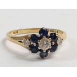 A Sapphire and Diamond Cluster ring. set in 18 carat yellow. Size P. 3.30 grams.