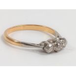 A Three Stone Diamond Ring. set in 18 carat yellow gold. Size L. 1.9 grams.