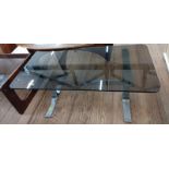 A chrome and black tinted glass coffee table