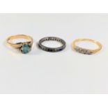 An eternity ring. Size J. 2.2 grams. A Topaz se ring. Set in 9 carat gold. 2.99 grams. A Five