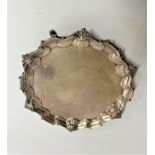 James Morison. A Late george II Sterling silver waiter. London 1751. With waved shell and scroll