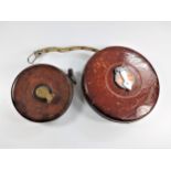 Two Imperial leather Bound Tape measures.