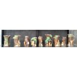 Nine Hornsea deer, rabbit, and squirrel tree-trunk vases and jugs. 15cm to 21cm (9)