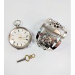 A swiss Fob watch, late 19th century, with a key and a sterling silver napkin ring.