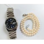 A Cultured pearl necklace. 41cm long. And a Gentleman's Seiko Watch.