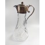 A silver plated mounted Cut glass claret Jug. Inscribed. 28cm high.