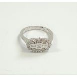 Certificated 18ct white gold boat-style Round Brillian Cut and baguette diamond ring.