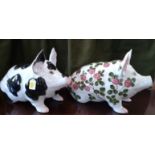 Wemyss black and white pig 42cm (one ear chipped, tail incomplete), and pig with floral decoration